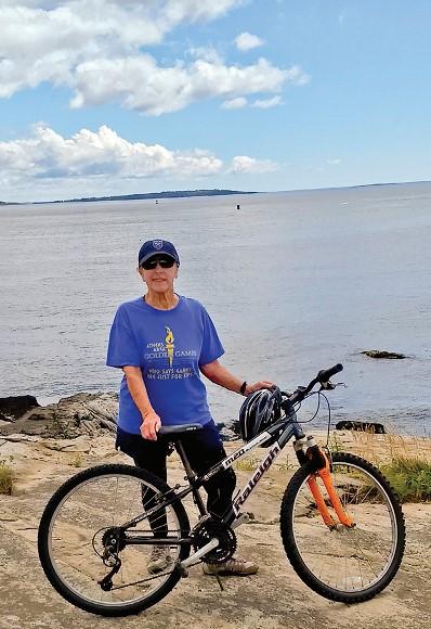 Bette McNeely recently biking in Maine